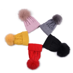 Winter knit baby hats with large faux fur pom-poms in five colors with cable knit texture