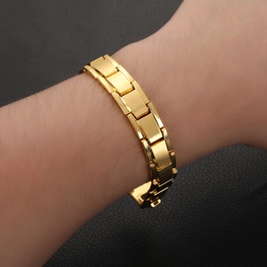 Polished gold magnetic therapy bracelet for men shown on wrist with classic link design