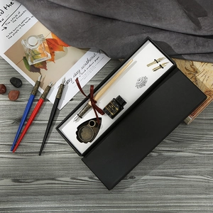 Vintage calligraphy dip pen set with 4 pen holders, ink, and gold nibs in a gift box
