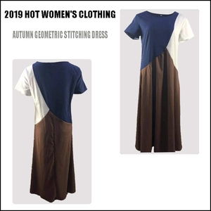 Detail van geometrische maxi-jurk met kleurvlakken in marineblauw, wit en bruin