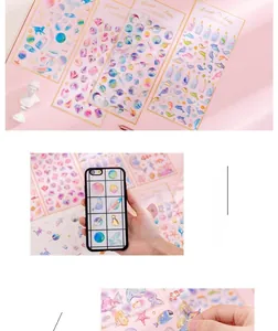 Detail of Lunar's tears holographic stickers showing PET waterproof galaxy and ocean patterns