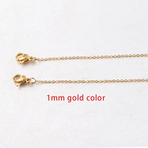 Macro shot of 1mm gold-plated stainless steel square link chain with lobster clasp detail