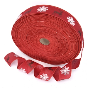 Red Christmas burlap ribbon with white snowflake and reindeer patterns for gift wrapping