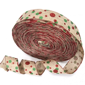 Close-up of burlap Christmas ribbon featuring red and green glitter dots for DIY gifts