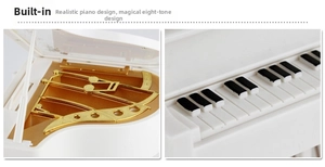 Close-up of white piano music box showing internal gold movement and keyboard details