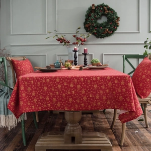 Christmas red tablecloth with gold foil snowflakes and bells for holiday dining tables