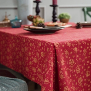 Christmas red table cloth with gold foil snowflakes and bells for festive dining decor