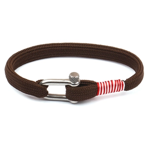 Brown braided rope bracelet with silver U-shackle clasp and red thread detail