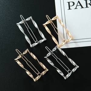 Set of four geometric wavy rectangle hair clips in matte and polished gold and silver