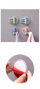 Detalle del soporte adhesivo para ganchos de pared giratorios en colores Macaron