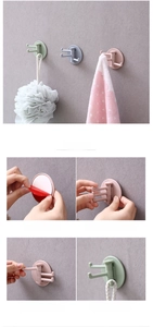 Instructional view of rotating 3-arm adhesive hooks showing installation steps on wall