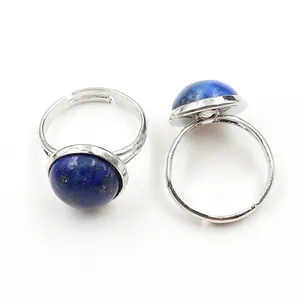 Adjustable silver ring with round blue lapis lazuli stone and natural mineral flecks