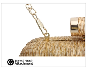Detail of the high-quality gold metal chain hook on a woven handmade straw clutch bag