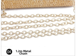 Detail of 1.2m gold metal chain strap for hand-woven straw evening clutch bag
