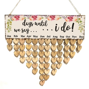 Floral wooden wedding countdown plaque with monthly heart-shaped hanging wood pieces