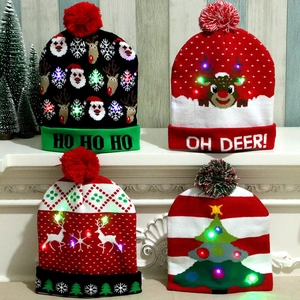 Set of four festive LED knitted Christmas hats with colorful glowing lights and pom-poms