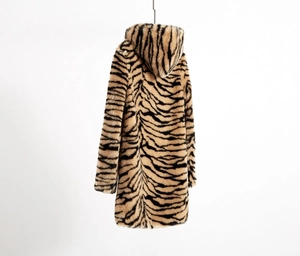 Detail shot of the faux fur texture and tiger stripe pattern on this hooded winter coat
