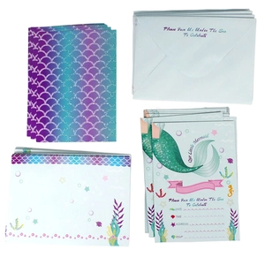 Detail of mermaid party invitation cards with envelopes and purple fish scale patterns
