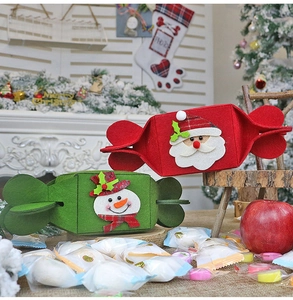 Detail of Christmas felt candy bags featuring Santa and Snowman with thick texture