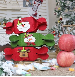 Macro shot of candy-shaped felt Christmas gift bags with festive Santa and snowman patches