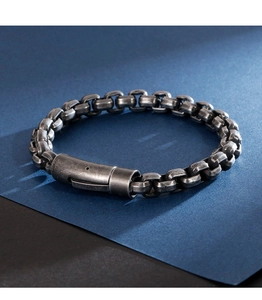 Detail of vintage industrial steel box chain bracelet with matte distressed silver finish