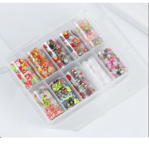 Close-up of 10 rolls of Christmas nail art transfer foils in a clear plastic organizer box