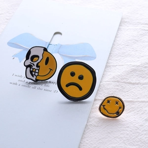 Cartoon enamel smiley and skull pins set in yellow and black alloy for backpacks