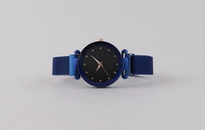 Detail view of starry sky dial with crystal hour markers and blue Milanese mesh strap