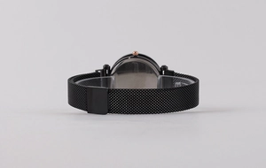 Detail view of black Milanese watch strap and rose gold crown with stainless steel back