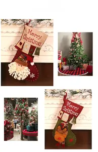 Close-up of linen Christmas stockings with Santa embroidery and Merry Christmas text