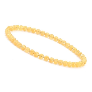 Detailed view of 4mm yellow tiger eye natural stone beads on a minimalist bracelet