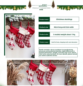 Detail of red and white knitted Christmas stocking with reindeer pattern and 40x22cm dimensions