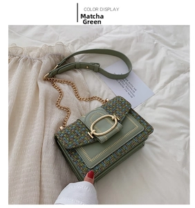 Close-up of matcha green woven crossbody bag with gold buckle and chain strap detail