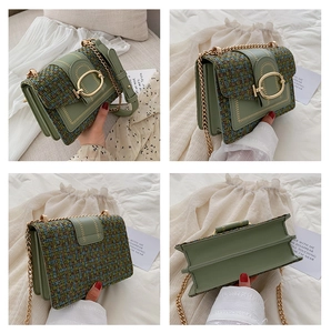 Detail view of tweed and PU leather patchwork handbag with gold metal chain strap