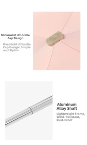 Detail of pink flat umbrella with gold metal top and silver aluminum alloy telescopic rod
