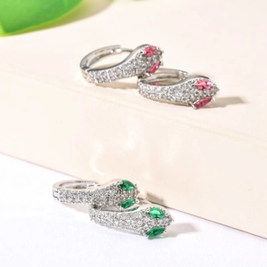Fashionable snake hoop earrings with green and red zircon eyes and white crystal stones