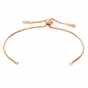 Detail of rose gold adjustable box chain bracelet with sliding clasp and clear stones