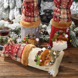 Christmas burlap wine bottle covers with Santa and snowman designs for holiday table decor