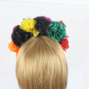 Rear view of Mexican floral headband with colorful peonies and a red butterfly detail