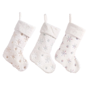 Three white faux fur Christmas stockings with gold and silver sequined snowflake patterns