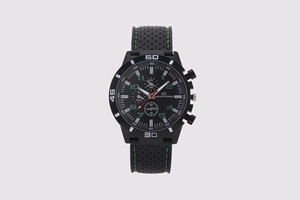 Detail view of sport watch dial with green numbers and three sub-dials on black silicone strap