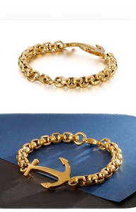 Detail of masculine gold stainless steel anchor bracelet with rugged square link chain