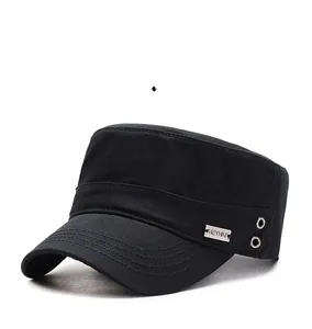Macro shot of black flat top military cap featuring metallic ventilation holes and logo