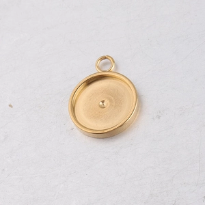 Macro detail of a golden stainless steel pendant base for DIY jewelry making