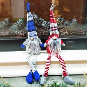 Christmas gnome dolls in blue and red plaid, festive Nordic plush figures on white steps