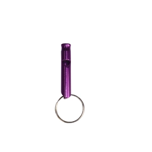Close-up of a purple aluminum emergency whistle with a metal keyring on white background