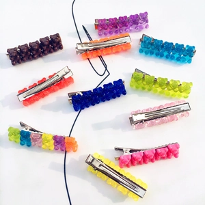 Colorful candy gummy bear hair clips set on a minimalist background for women