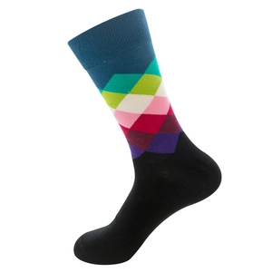 Detail of colorful geometric argyle pattern socks with bright gradient stitch textures