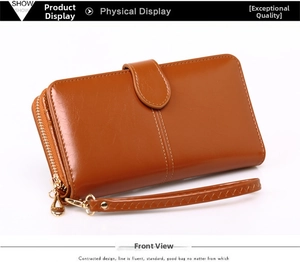 Brown leather wristlet wallet with smooth gold zipper and elegant carry strap