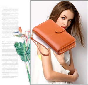 Chic orange faux leather long wallet with double zippers and detachable wrist strap